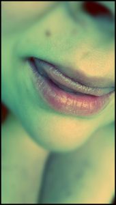 Close up shot of womans lips and mouth