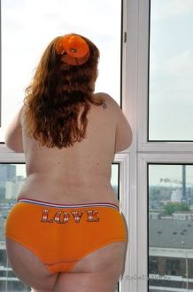 Dutch woman with orange hair and panties