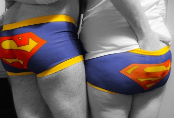couple wearing matching superhero pants