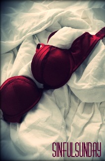 Red bra on white sheets