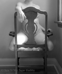 Naked woman on chair