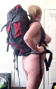 Naked girl wearing backpack