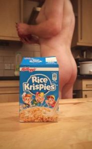 Naked man behind Rice Krispies packet