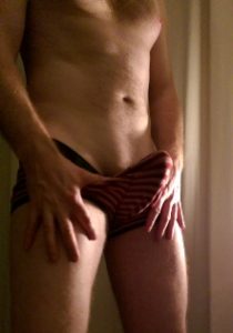 Man with erect penis inside his underwear