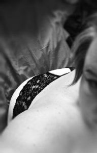 Looking down woman's back to her back lace panties
