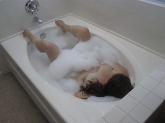 Woman in bubble bath masturbating