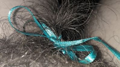 blue bow tied in pubic hair