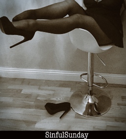 Women in high heels on bar stool
