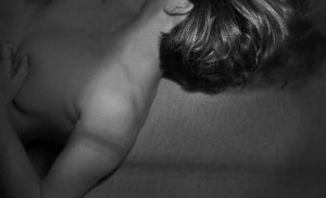 Black and white shot of exposing 40 showing off her bare neck