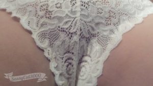 Close up shot of lace panties between her legs