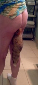 Woman wearing fox tail butt plug