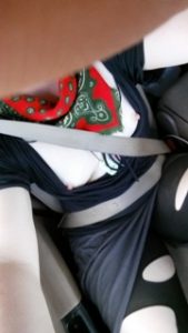 Woman in car with ripped leggins and tits showing