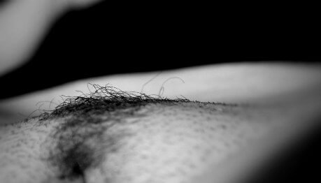 Macro shot of womans pubes in black and white