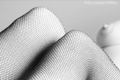 Topless woman in fishnets