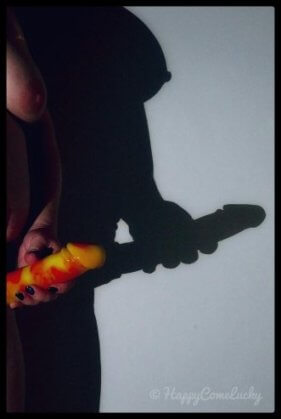 Shadow of woman wearing strapon cock
