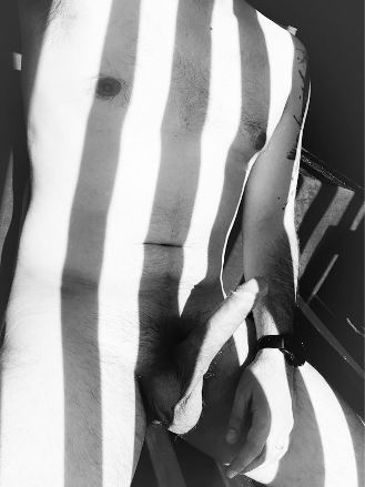 Naked man with erection and shadow stripes on his body