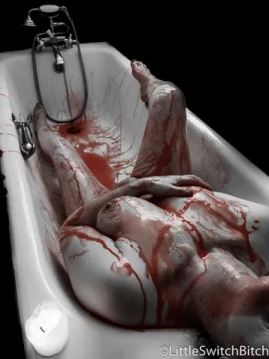woman naked in the bath covered in blood