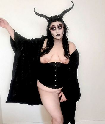 Devvie where underbust black corset and demon horns with breast showing