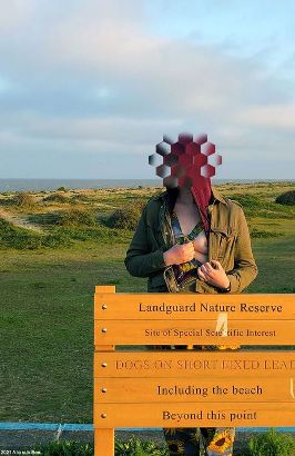 Bee showing of her breast by nature reserve sign