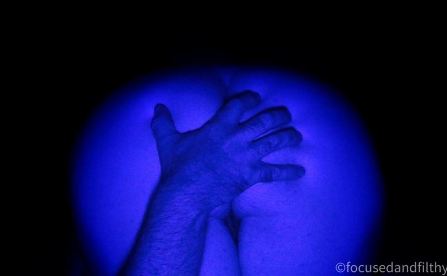 Missy's bum edited in blue light with hand covering