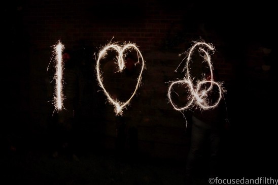 Sparkler drawing in night sky that says I then heart shape then a penis shape