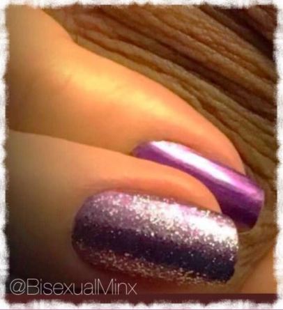 purple nails on fingers that are touching skin on a scrotum