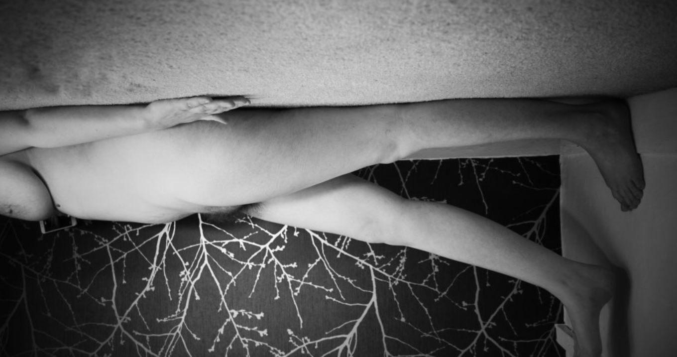 cropped image, black and white of my wild lens hanging from the ceiling walking