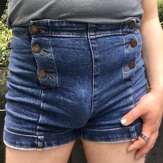 Quinn wearing tight high waist shorts that show of their dick bulge