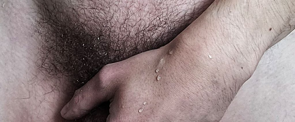 Cropped image of man's hand over his penis and wet pubes for weekly round-up 653