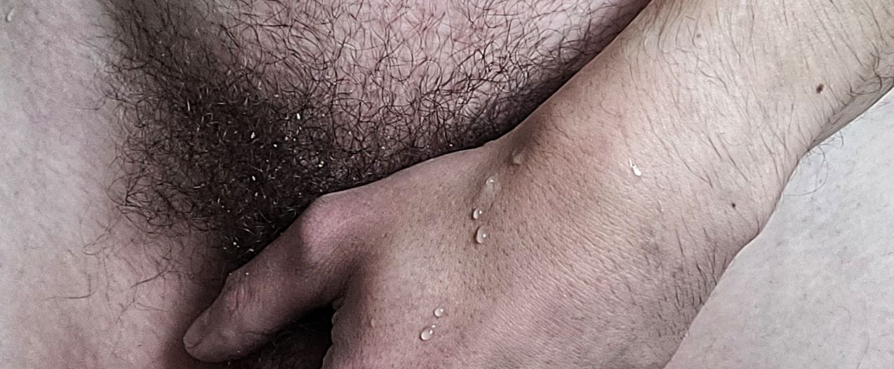 Cropped image of man's hand over his penis and wet pubes for weekly round-up 653