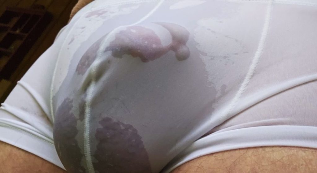 Cropped image of Jer bear in tight white pants