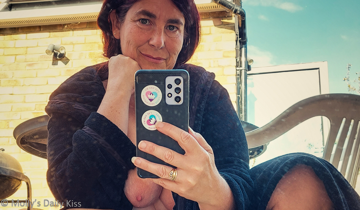 Cropped image of molly taking a selfie in a mirror